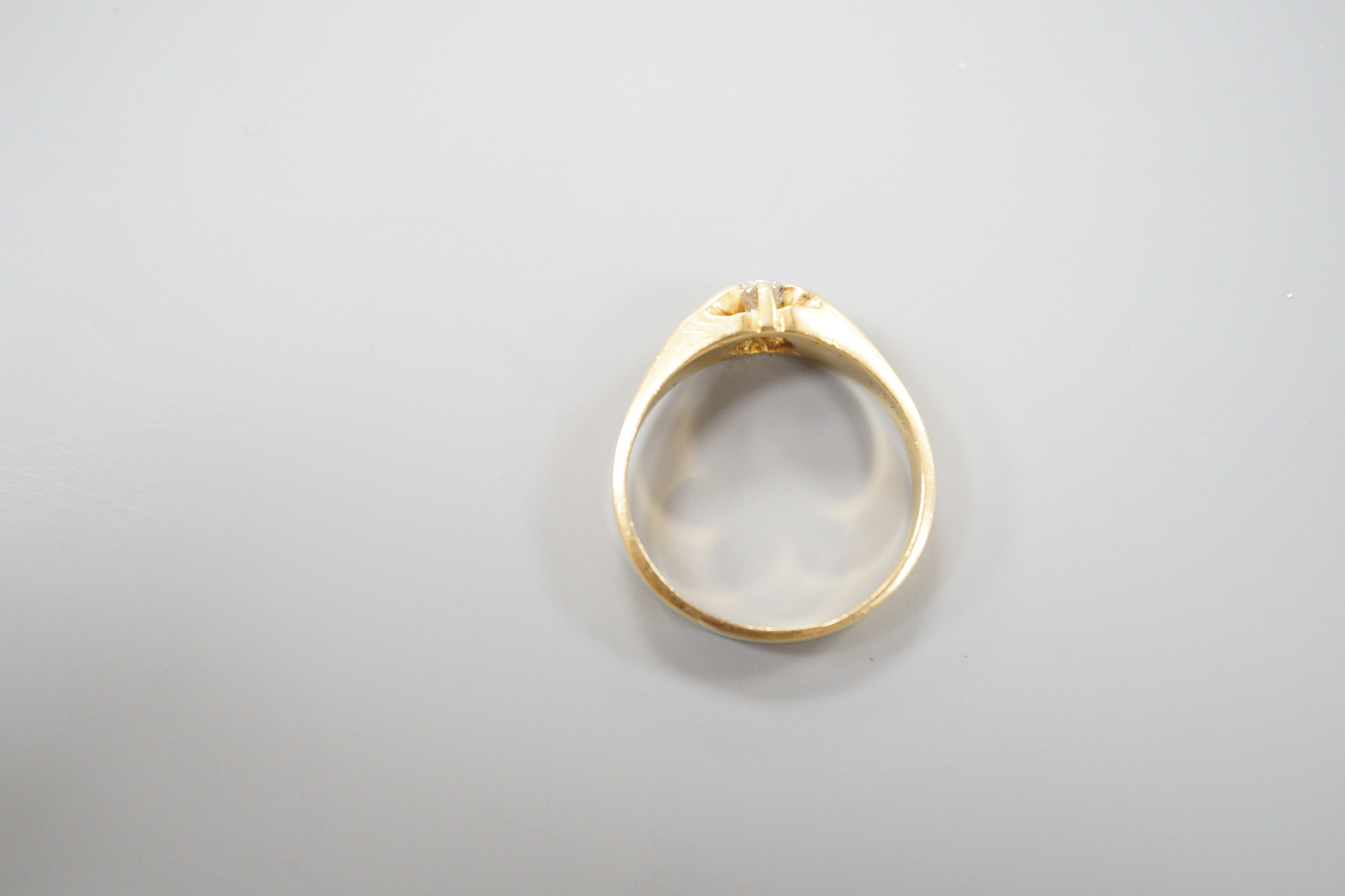 A late Victorian 18ct gold and claw set solitaire diamond ring, size, S/T, gross 6.3 grams.